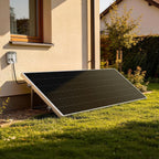 Plug-in solar panel on a lawn, plugged into an outdoor outlet